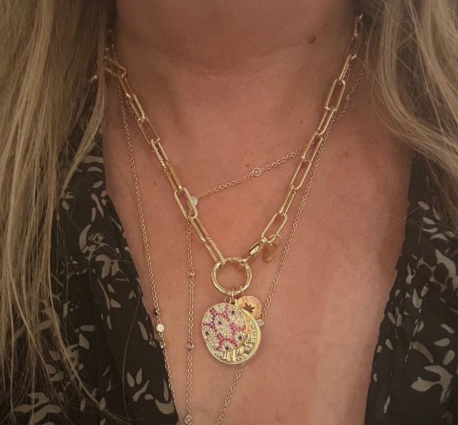 CALYPSO II from IFI BIJOUX’s Sky Stack — an 18k gold-filled twisted rope chain with a removable charm holder and three symbolic charms. Grace in motion. Glamour on arrival.